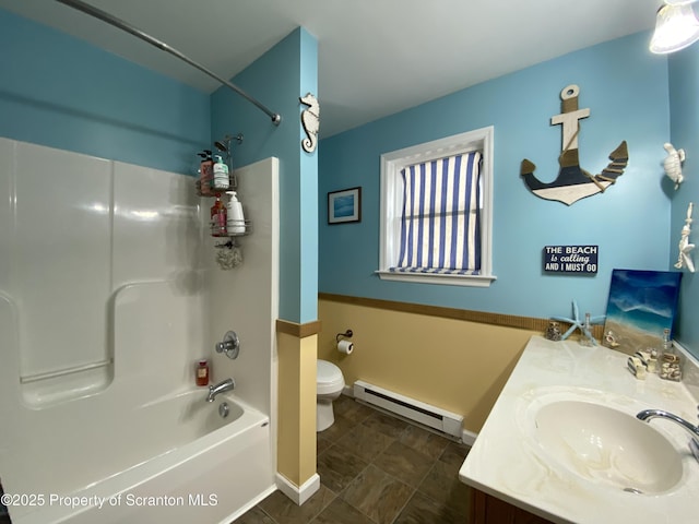 full bathroom featuring vanity, bathtub / shower combination, baseboard heating, and toilet