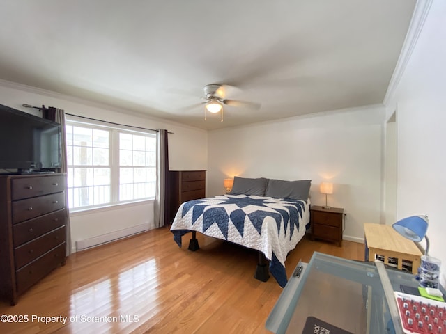 bedroom featuring crown molding, ceiling fan, wood-type flooring, and a baseboard radiator