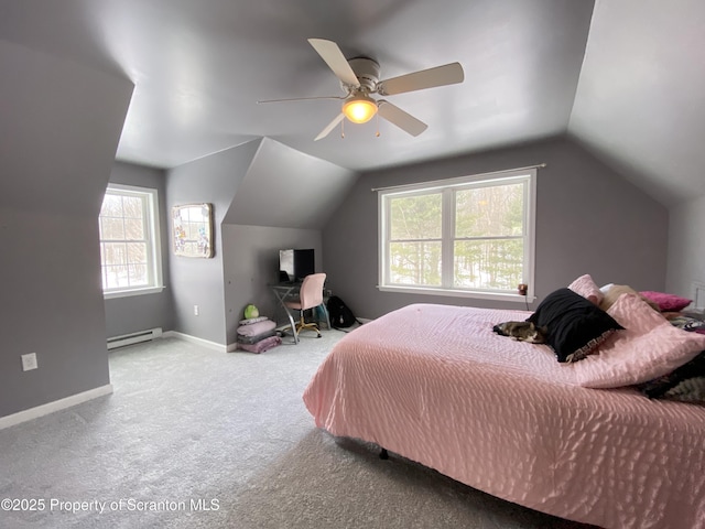 bedroom with ceiling fan, vaulted ceiling, multiple windows, and a baseboard heating unit