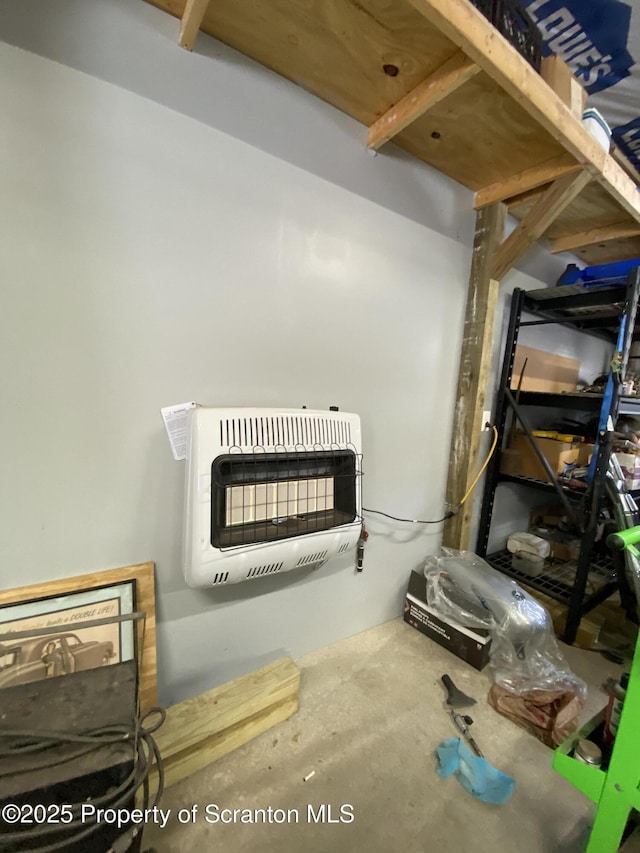 details featuring heating unit and concrete flooring