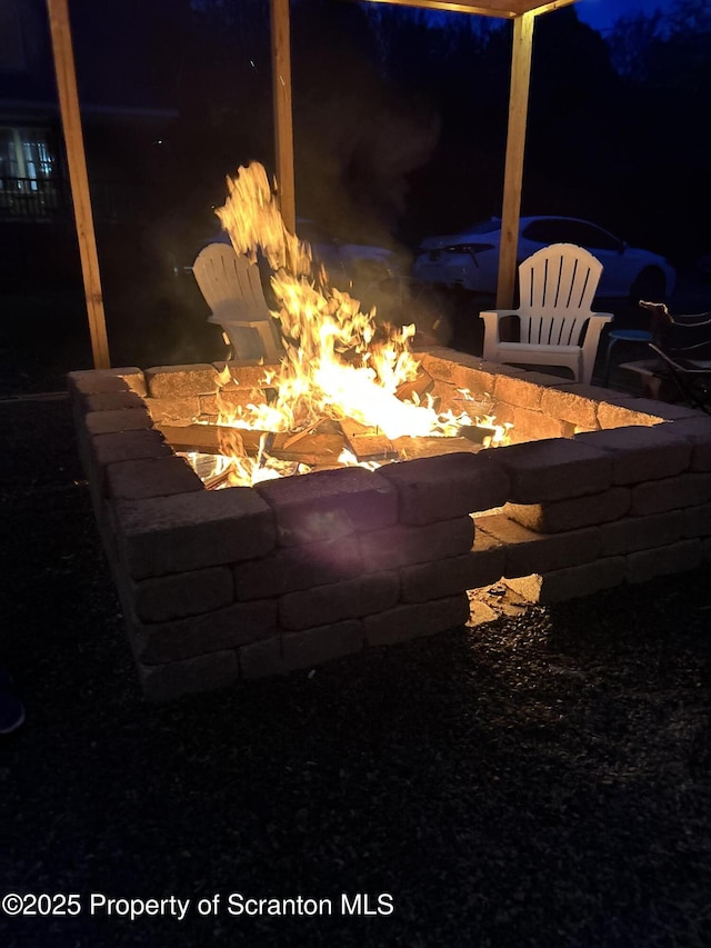 exterior details with a fire pit