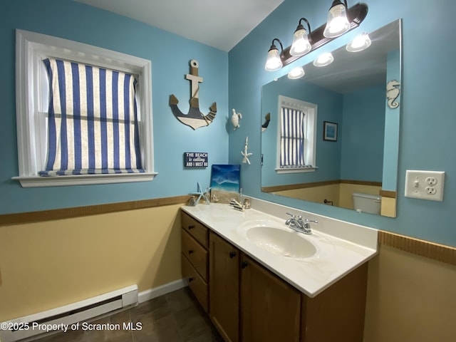 bathroom with vanity, tile patterned flooring, a baseboard radiator, and toilet