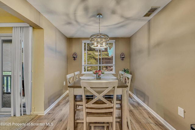 1504 Summit Pt Unit 1504, Scranton, PA 18508 - dining area with light wood finished floors and a chandelier