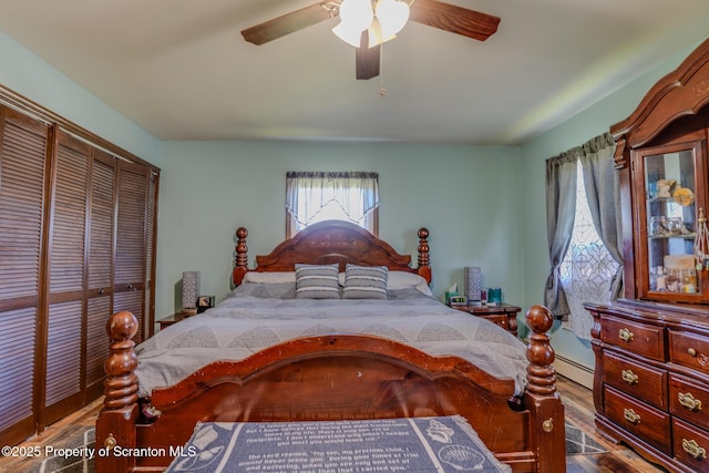 bedroom with ceiling fan, a baseboard radiator, a closet, and wood finished floors