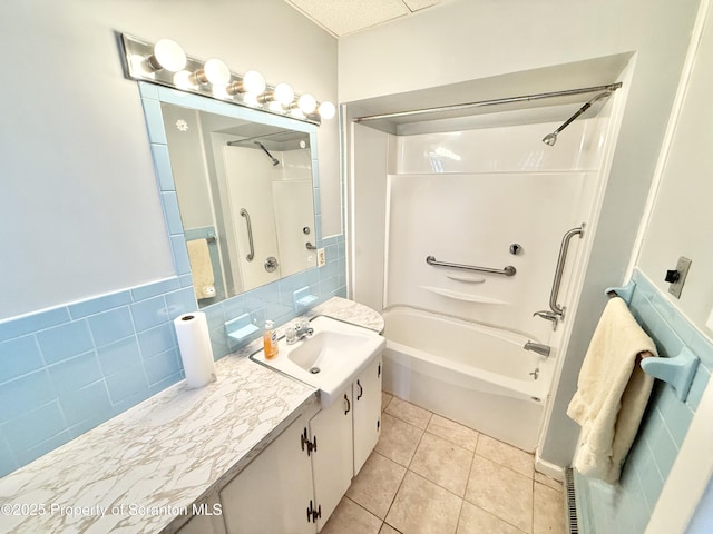 full bathroom featuring bathtub / shower combination, vanity, and tile patterned floors