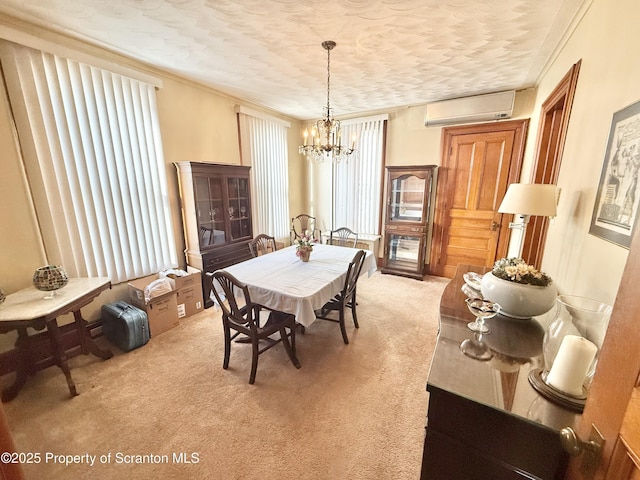 dining space with light carpet, ornamental molding, a textured ceiling, a chandelier, and a wall mounted AC