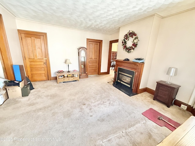 carpeted living room with a fireplace with flush hearth, crown molding, baseboards, and a textured ceiling