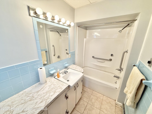 full bath featuring vanity, bathing tub / shower combination, and tile patterned floors