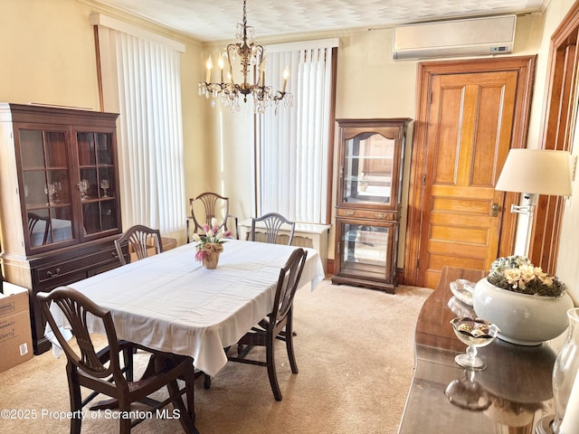 dining space with crown molding, carpet floors, a wall mounted air conditioner, and a notable chandelier