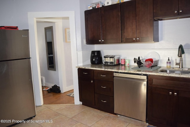 616 Delaware St, Scranton, PA 18509 - kitchen featuring stainless steel appliances, backsplash, light stone countertops, and dark brown cabinetry