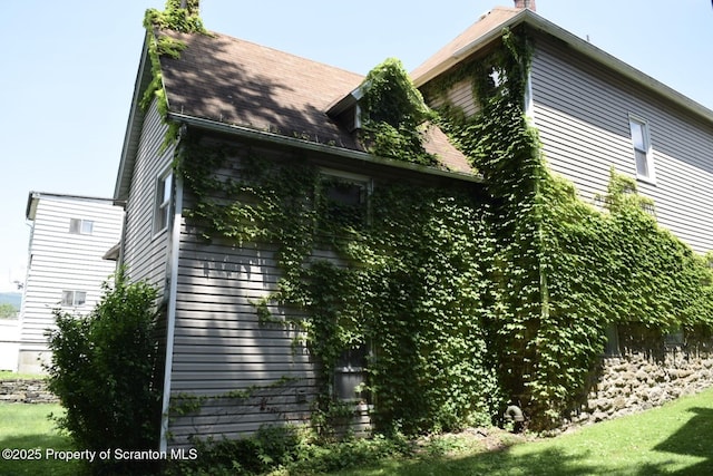 616 Delaware St, Scranton, PA 18509 - view of property exterior with a chimney