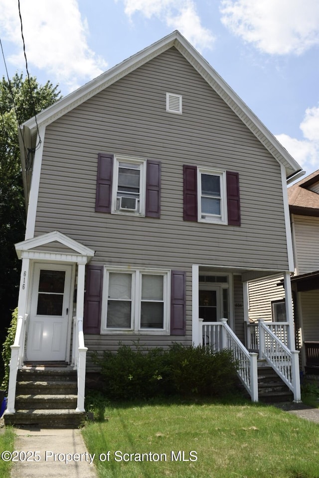 616 Delaware St, Scranton, PA 18509 - view of front facade featuring a front lawn, covered porch, and cooling unit