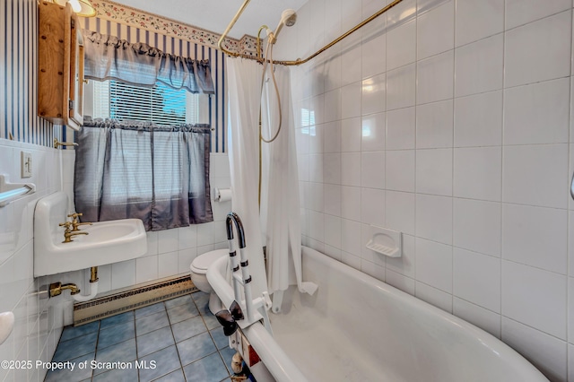 full bathroom featuring tile walls, a baseboard heating unit, toilet, shower / bathtub combination with curtain, and tile patterned floors