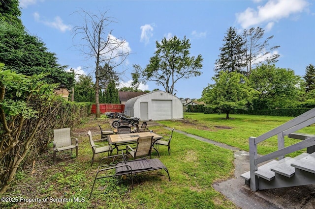1223 Eynon St 1221, Scranton, PA 18504 - view of yard featuring an outdoor structure, a detached garage, and outdoor dining space