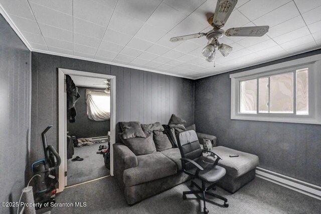 1223 Eynon St 1221, Scranton, PA 18504 - carpeted home theater with a baseboard heating unit, ceiling fan, crown molding, and wooden walls