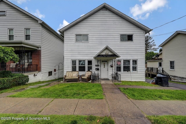 1223 Eynon St 1221, Scranton, PA 18504 - traditional-style house with a front yard and an outdoor living space