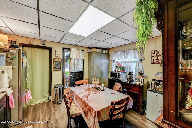 1223 Eynon St 1221, Scranton, PA 18504 - dining space with wood finished floors and a paneled ceiling