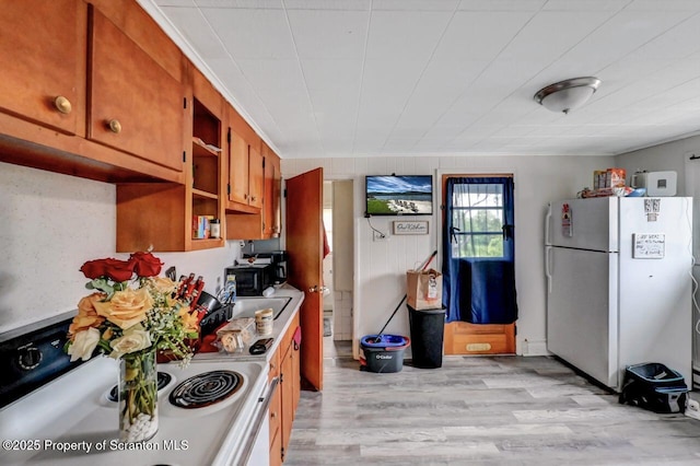 1223 Eynon St 1221, Scranton, PA 18504 - kitchen with white appliances, a sink, brown cabinets, light wood-type flooring, and open shelves