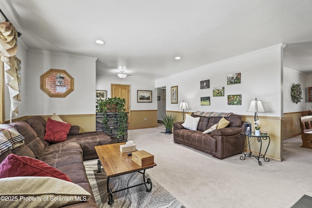 carpeted living room with recessed lighting, wainscoting, and crown molding