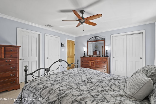 bedroom with a closet, light colored carpet, and crown molding