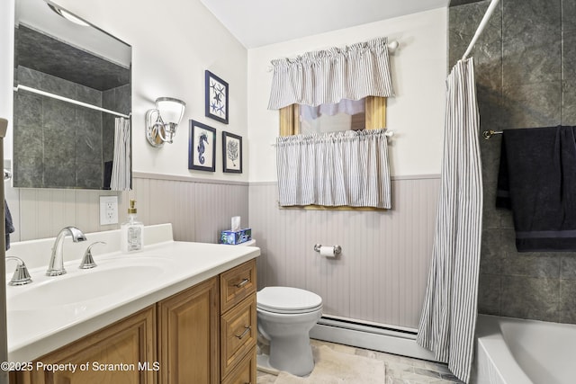 bathroom with a wainscoted wall, toilet, a baseboard radiator, and vanity