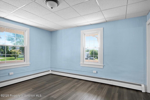 316 Sibley Ave, Old Forge, PA 18518 - empty room with dark wood-type flooring and a paneled ceiling