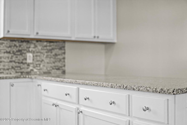 316 Sibley Ave, Old Forge, PA 18518 - kitchen featuring white cabinetry, tasteful backsplash, and light stone counters