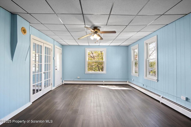 316 Sibley Ave, Old Forge, PA 18518 - spare room with dark wood-style flooring, a drop ceiling, ceiling fan, baseboards, and a baseboard radiator