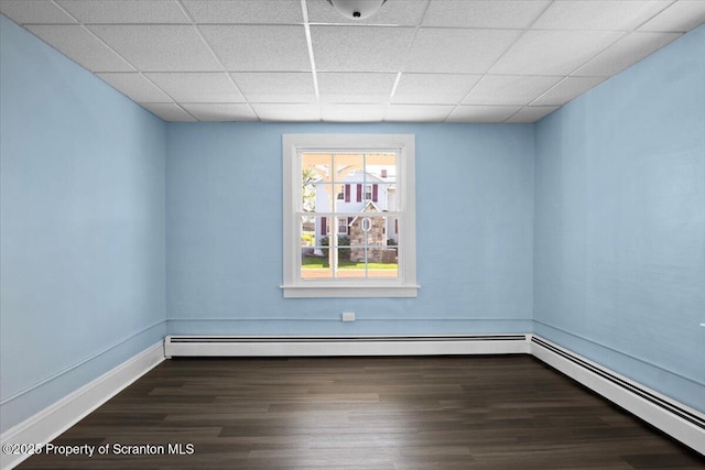 316 Sibley Ave, Old Forge, PA 18518 - spare room with a drop ceiling, wood finished floors, a baseboard heating unit, and baseboards