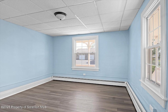 316 Sibley Ave, Old Forge, PA 18518 - spare room featuring wood finished floors, a drop ceiling, and baseboards