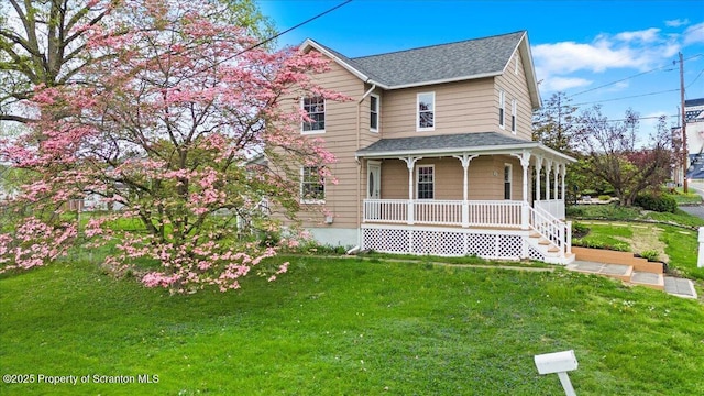 316 Sibley Ave, Old Forge, PA 18518 - view of front of house with a porch, a shingled roof, and a front lawn