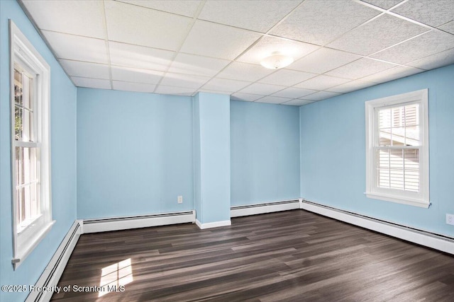 316 Sibley Ave, Old Forge, PA 18518 - unfurnished room with wood finished floors, a drop ceiling, baseboard heating, and baseboards