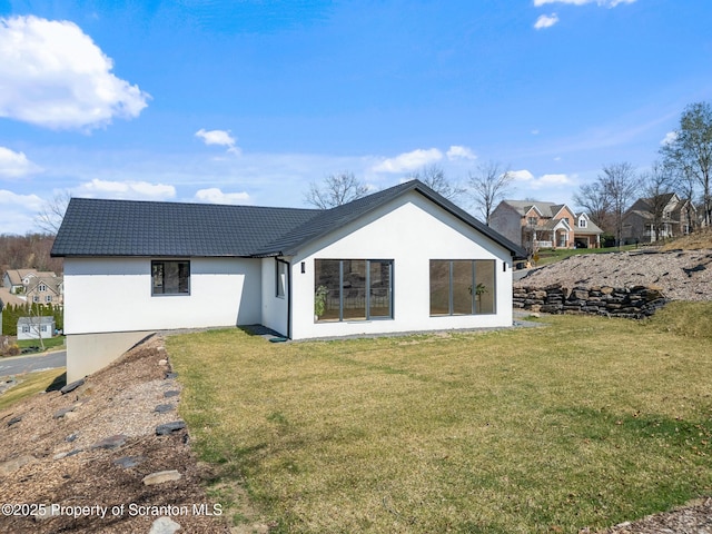 203 Red Oak Dr, Olyphant, PA 18447 - back of house with a yard, a tile roof, and stucco siding