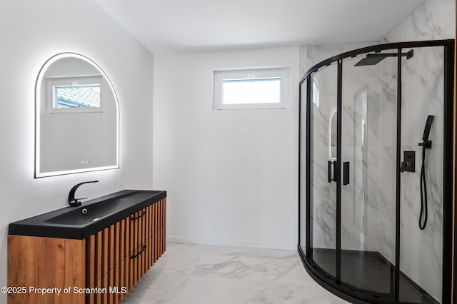203 Red Oak Dr, Olyphant, PA 18447 - bathroom featuring vanity, marble finish floor, plenty of natural light, and a marble finish shower