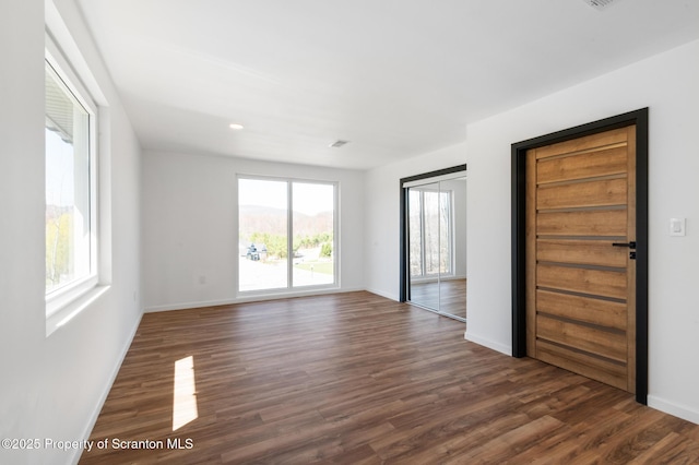 203 Red Oak Dr, Olyphant, PA 18447 - unfurnished room with baseboards, dark wood finished floors, visible vents, and recessed lighting