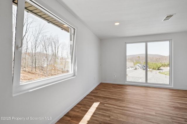 203 Red Oak Dr, Olyphant, PA 18447 - spare room featuring recessed lighting, visible vents, baseboards, and wood finished floors