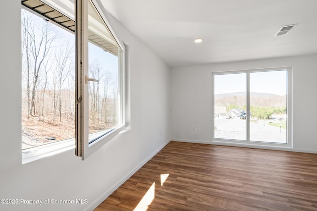 203 Red Oak Dr, Olyphant, PA 18447 - empty room with visible vents, baseboards, recessed lighting, and wood finished floors