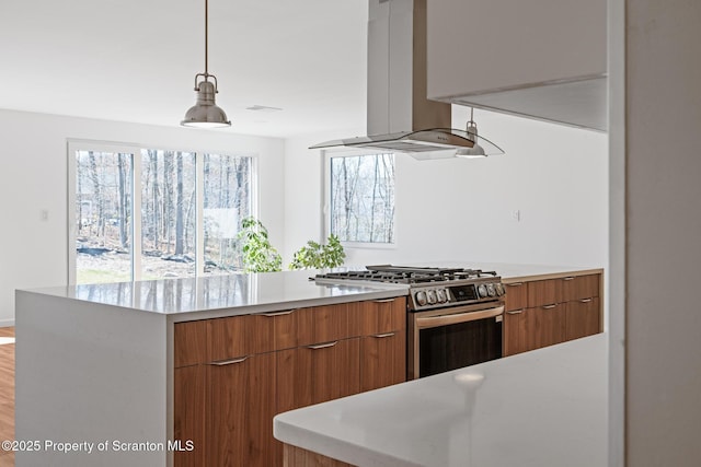 203 Red Oak Dr, Olyphant, PA 18447 - kitchen featuring gas stove, light countertops, modern cabinets, and island range hood