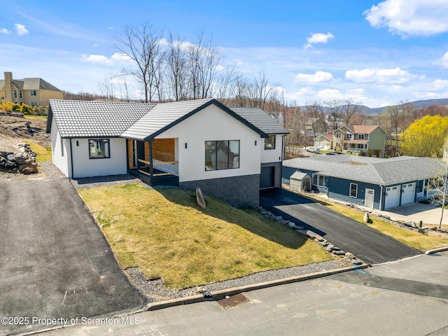 203 Red Oak Dr, Olyphant, PA 18447 - ranch-style home featuring a front yard, a tile roof, a residential view, and driveway