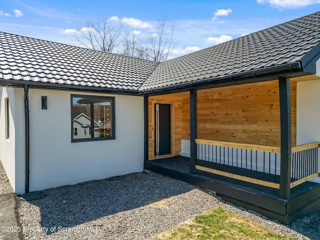 203 Red Oak Dr, Olyphant, PA 18447 - back of house with stucco siding and a tile roof