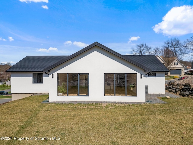 203 Red Oak Dr, Olyphant, PA 18447 - rear view of property with stucco siding, a tiled roof, and a lawn