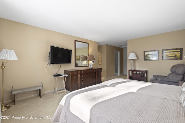 bedroom featuring light colored carpet