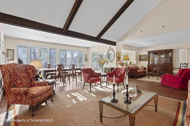 living room featuring beam ceiling, tile patterned flooring, and high vaulted ceiling