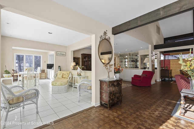 living room featuring beam ceiling