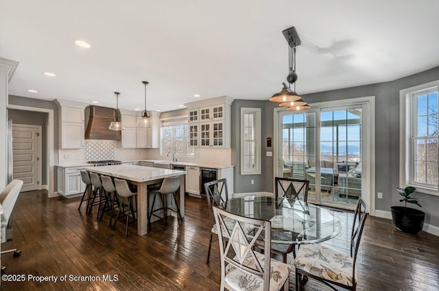 dining area featuring baseboards, dark wood-style flooring, and recessed lighting