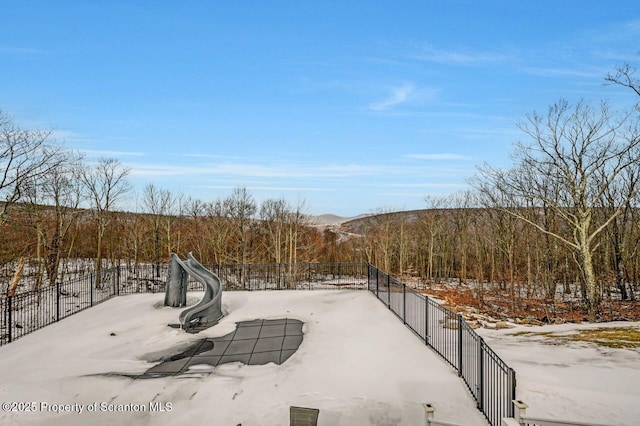 view of home's community with fence