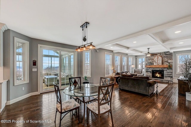 dining area with dark wood finished floors, a fireplace, coffered ceiling, beamed ceiling, and baseboards