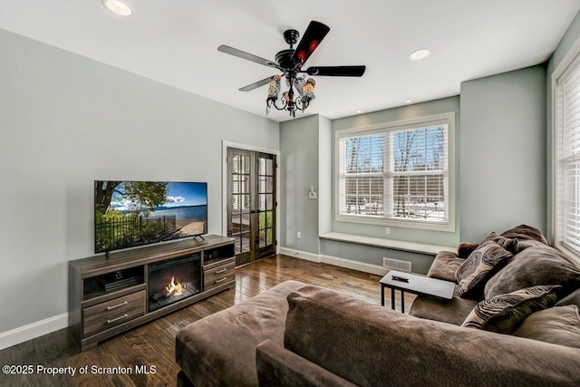 living area with french doors, recessed lighting, ceiling fan, wood finished floors, and baseboards