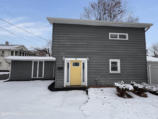 view of front facade featuring a shed