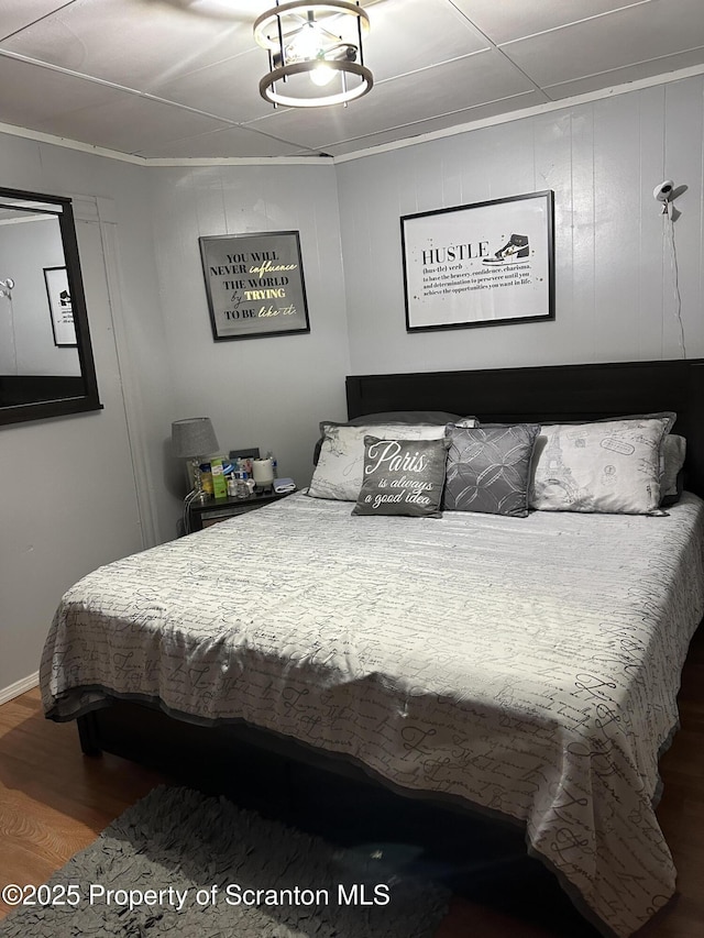 bedroom with wood finished floors